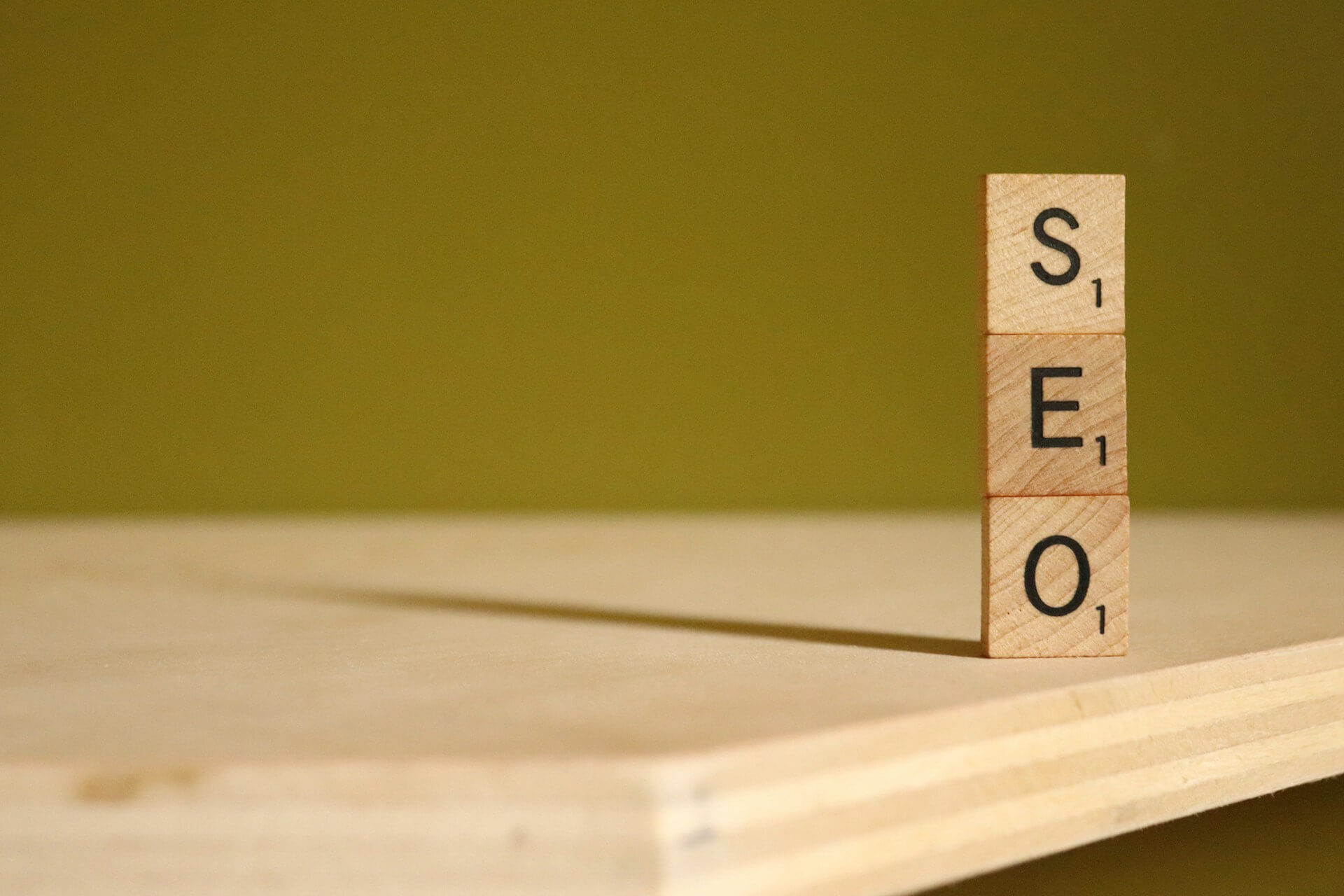 3 bricks spelling SEO on a wooden table