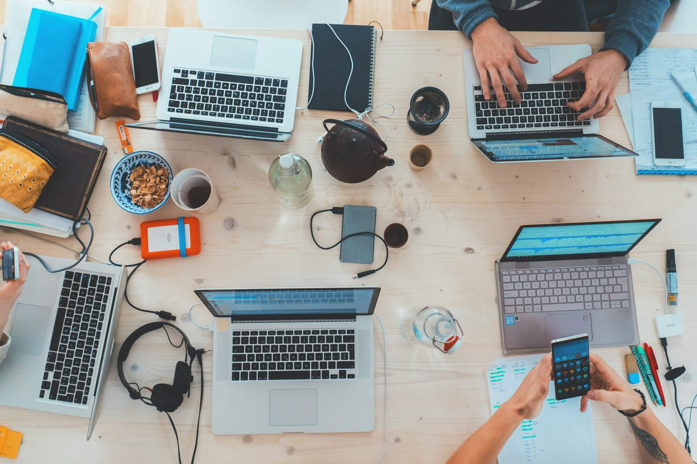 Laptops on a table in a meeting room