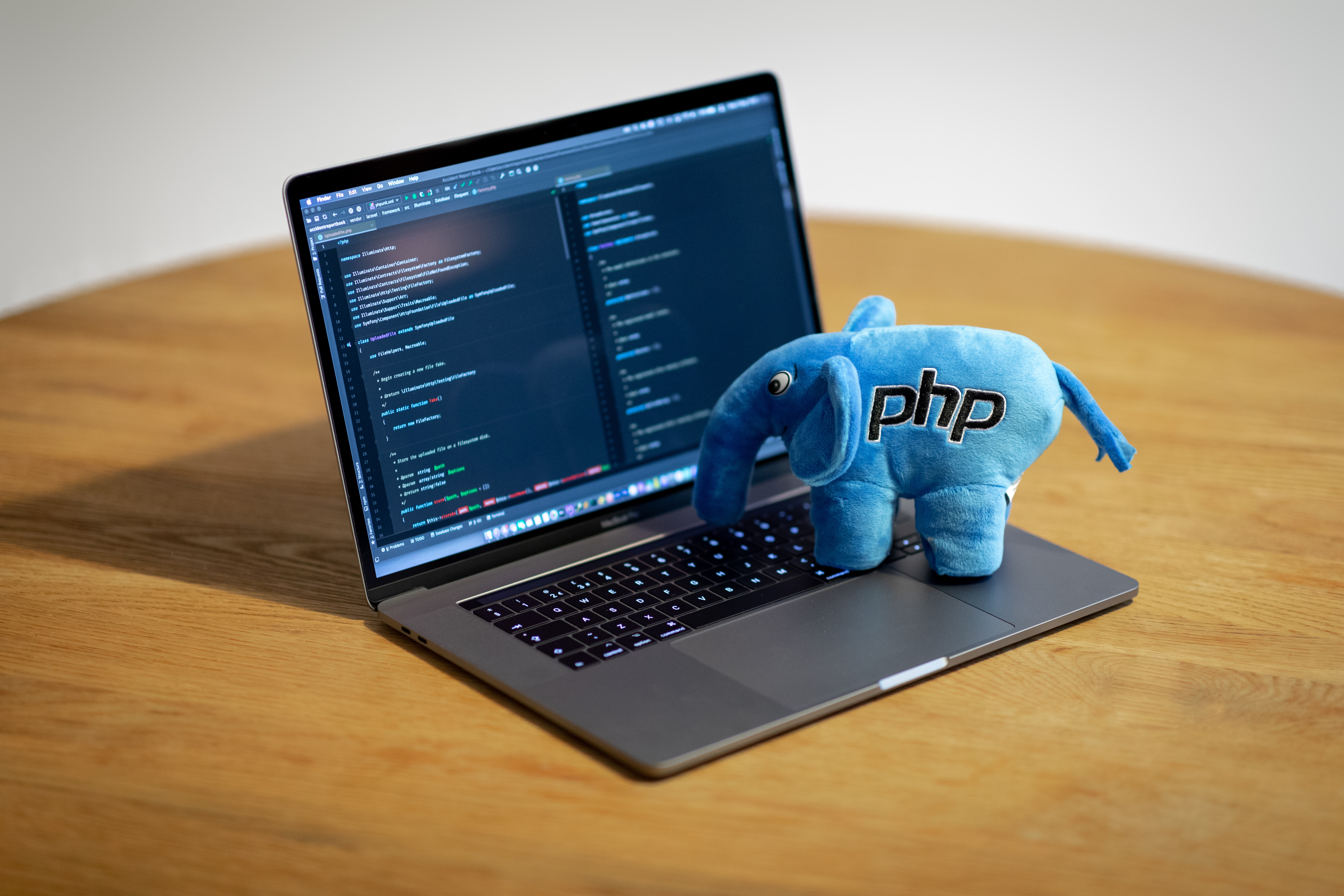 PHP elephant standing on a laptop